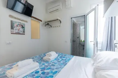 Letto o letti in una camera di Michelangelo's Place