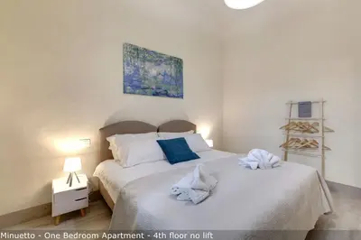 Letto o letti in una camera di Opera - Sinfonia - Minuetto - Melody Apartments by Mamo Florence