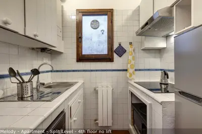 Cucina o angolo cottura di Opera - Sinfonia - Minuetto - Melody Apartments by Mamo Florence