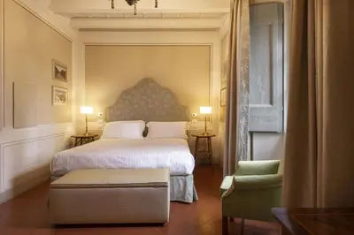 Letto o letti in una camera di Torre a Cona Wine Estate