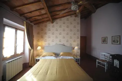 Letto o letti in una camera di B&B Le Dimore di Mezza Costa - Home Restaurant & Cooking Classes