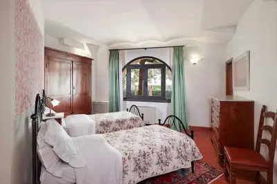 Letto o letti in una camera di Villa I Leoni