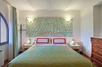 Letto o letti in una camera di Villa I Leoni
