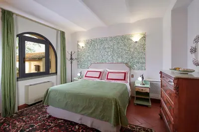 Letto o letti in una camera di Villa I Leoni