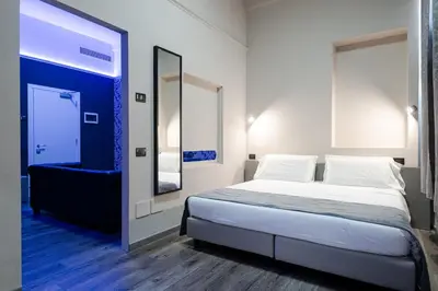 Letto o letti in una camera di The Gate Hotel - Firenze Nord