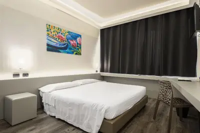 Letto o letti in una camera di The Gate Hotel - Firenze Nord