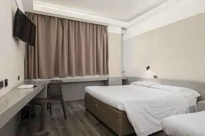 Letto o letti in una camera di The Gate Hotel - Firenze Nord