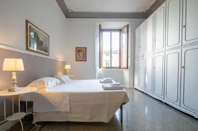 Letto o letti in una camera di Santa Maria Novella 4 bedrooms by Mmega