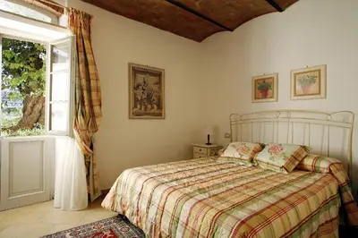 Letto o letti in una camera di Villa Pian De Noci - Tenuta del Palagio