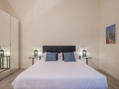 Letto o letti in una camera di BEAUTIFUL FLAT IN OLTRARNO