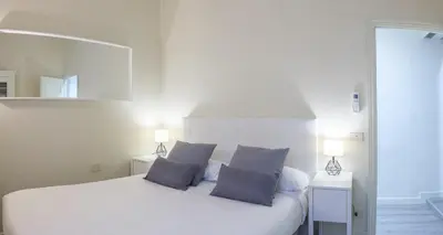 Letto o letti in una camera di BEAUTIFUL FLAT IN OLTRARNO