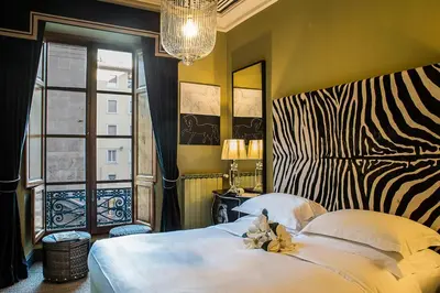 Letto o letti in una camera di Porcellino Gallery Art Boutique BB