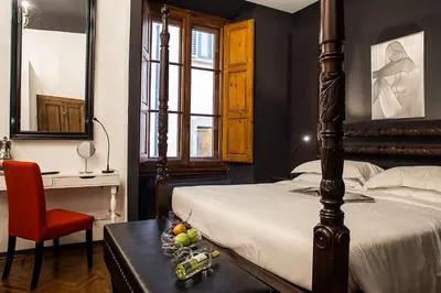Letto o letti in una camera di Porcellino Gallery Art Boutique BB