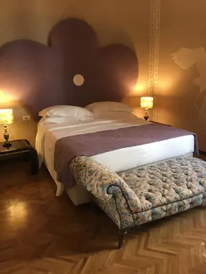 Letto o letti in una camera di Porcellino Gallery Art Boutique BB
