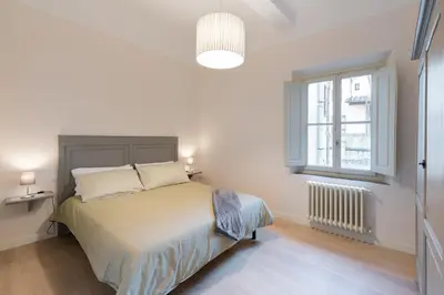 Letto o letti in una camera di PURE LUXURY IN OLTRARNO FLORENCE