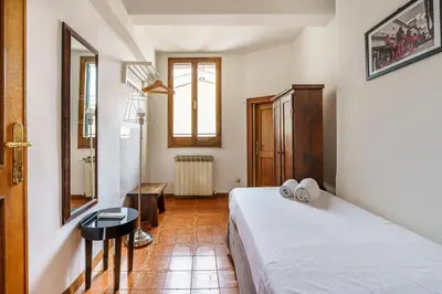 Letto o letti in una camera di Portinari Apartment