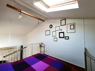 Letto o letti in una camera di Il loft di Nina