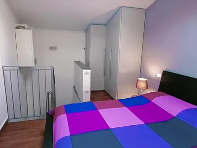 Letto o letti in una camera di Il loft di Nina