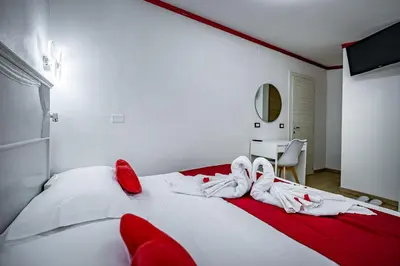 Letto o letti in una camera di HOTEL VENETO Centro Storico di Firenze