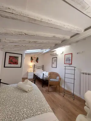 Letto o letti in una camera di Alloggi Palmini