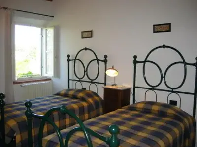 Letto o letti in una camera di Il Casalone