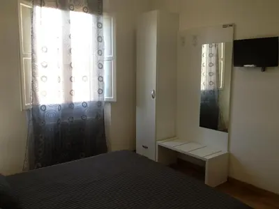 Letto o letti in una camera di Le Ghiacciaie