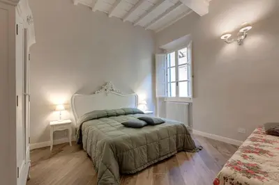 Letto o letti in una camera di Lambert Apartment