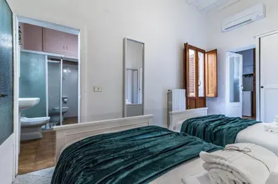 Letto o letti in una camera di Wine Apartments Florence Sangiovese