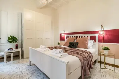 Letto o letti in una camera di Wine Apartments Florence Sangiovese