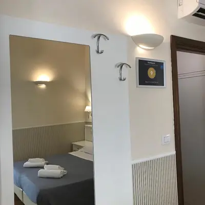 Letto o letti in una camera di Relais Campanile Adelaide
