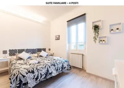 Letto o letti in una camera di DOMY'S GUEST HOUSE