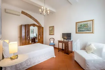 Letto o letti in una camera di Classic Tuscany Apartments by Mmega