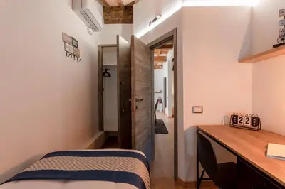 Letto o letti in una camera di Santa Trinita - Flo Apartments