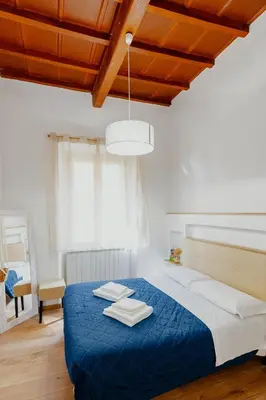 Letto o letti in una camera di Florence Rooms