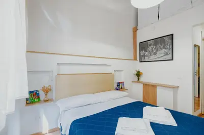 Letto o letti in una camera di Florence Rooms