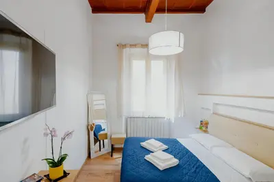 Letto o letti in una camera di Florence Rooms