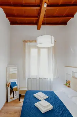 Letto o letti in una camera di Florence Rooms