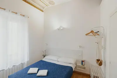 Letto o letti in una camera di Florence Rooms