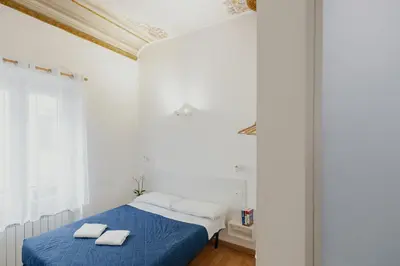 Letto o letti in una camera di Florence Rooms