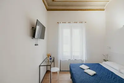 Letto o letti in una camera di Florence Rooms