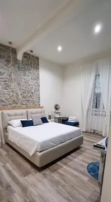 Letto o letti in una camera di Leopolda Suite