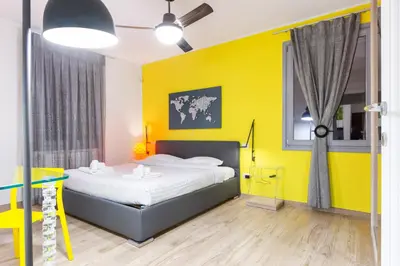Letto o letti in una camera di GuestHost - Colorful Boccaccio Apartment