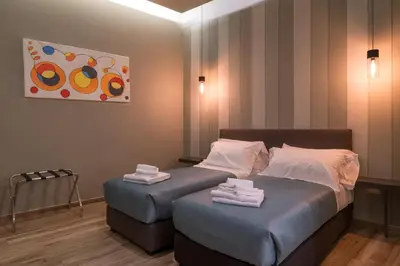 Letto o letti in una camera di GOGO` Petit Hotel