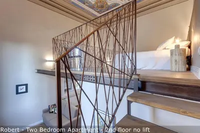 Letto o letti in una camera di Freedom Apartments by Mamo Florence
