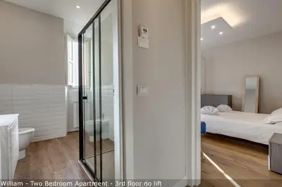 Letto o letti in una camera di Freedom Apartments by Mamo Florence