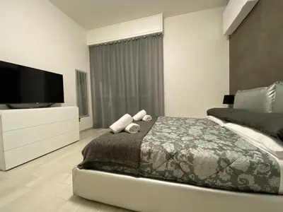 Letto o letti in una camera di GUEST HOUSE KINGA