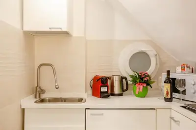 Cucina o angolo cottura di SuperCentral Suite Venus Dome View lift e AC 2 plus 2