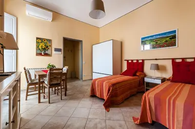 Letto o letti in una camera di All' Ombra Del Duomo
