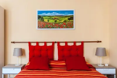 Letto o letti in una camera di All' Ombra Del Duomo