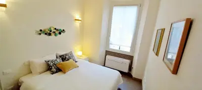 Letto o letti in una camera di Charming & spacious Florentine home just two mins from tram stop